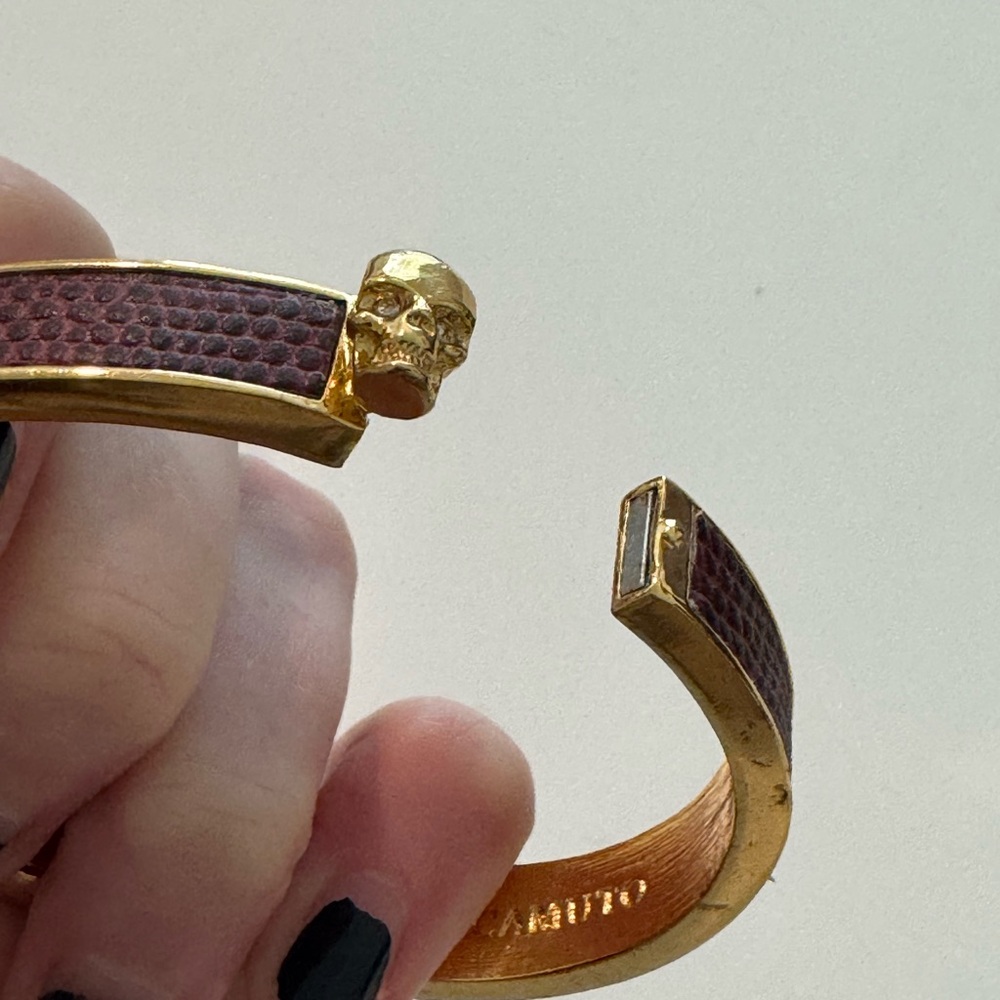 Vince Camuto red embossed leather gold skull bracelet